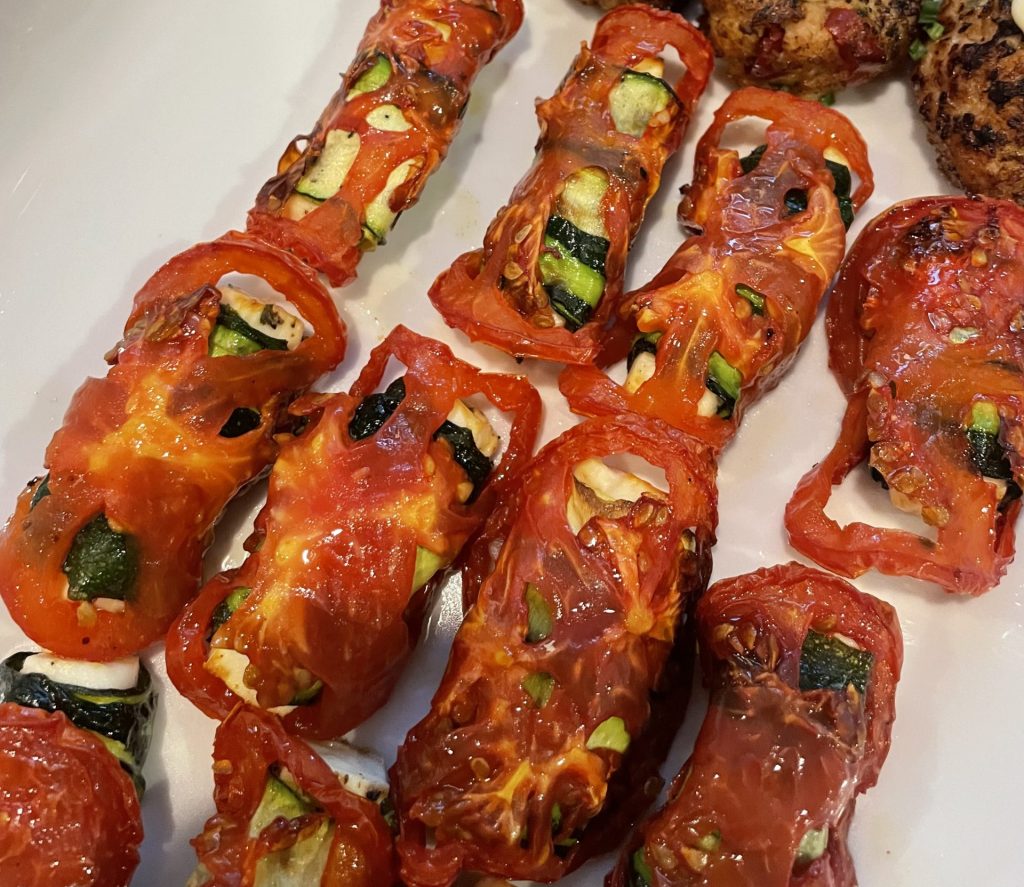 Tomato wrapped feta and zucchini for an Sure, here is the corrected text: "Hors d'oeuvre"
